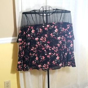 Black lace blouse with pink floral print.